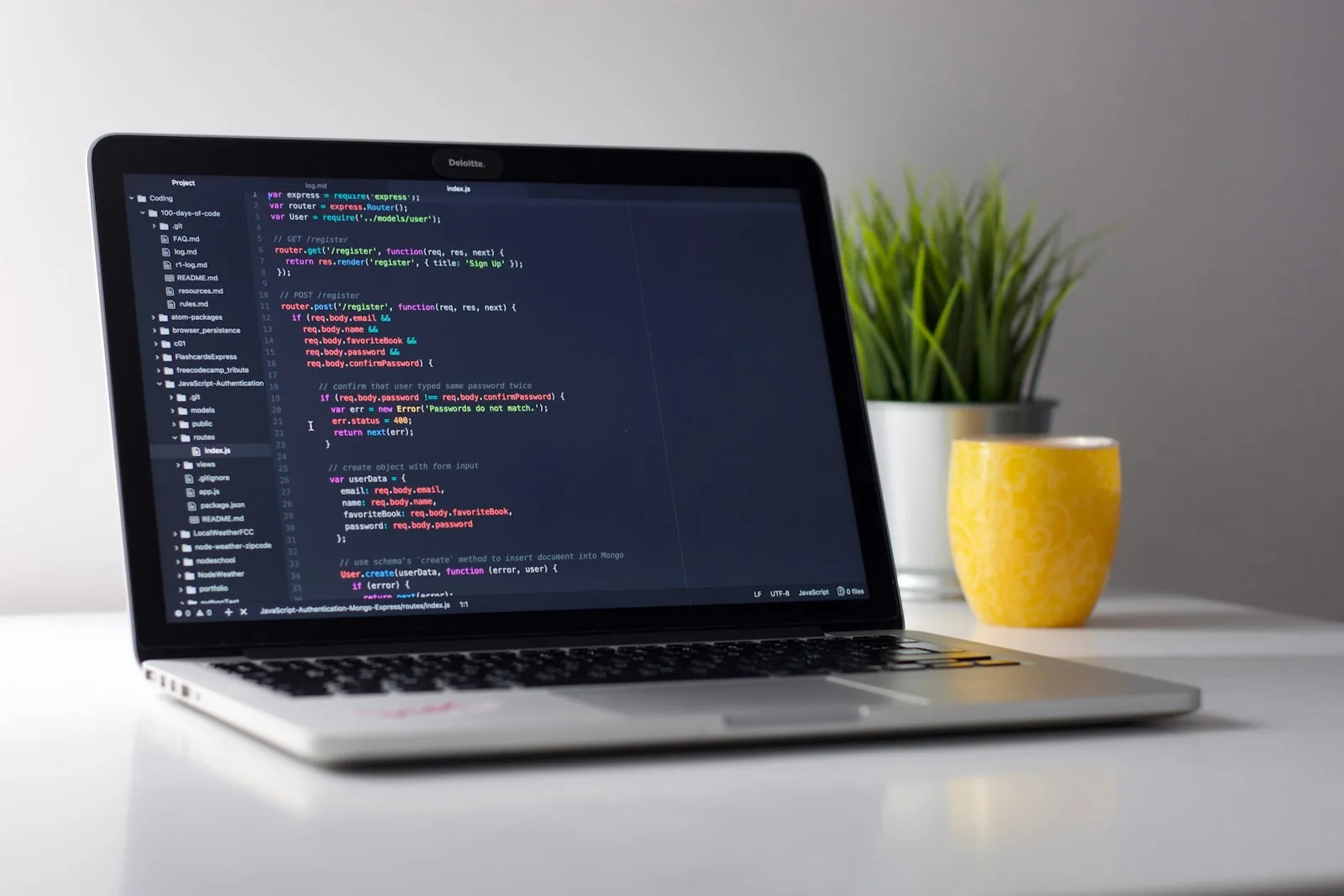 Monitor showing source code on a studio desk